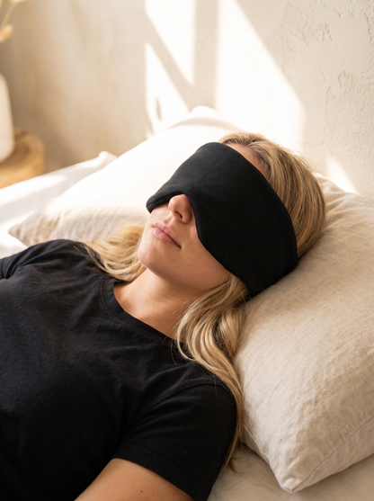 DAYBLIND Cotton Sleep Wrap worn lying on the side in a sunlit bedroom