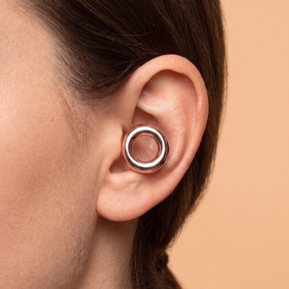 Metal Edition Earplugs in Rose Gold, worn in ear