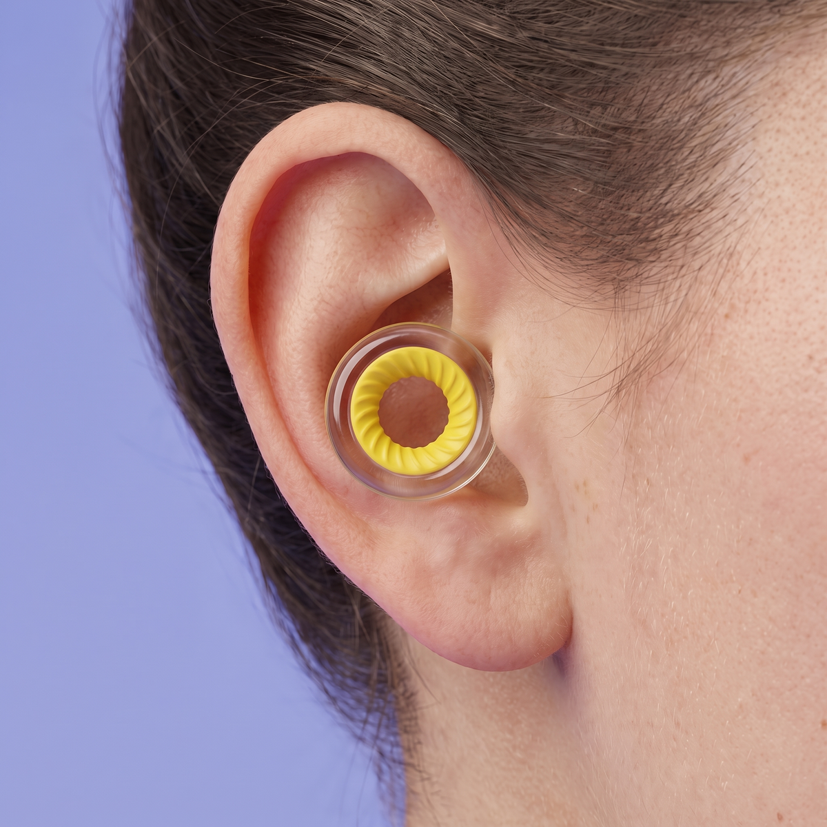 Ring Earplugs in Clear Yellow, worn in ear