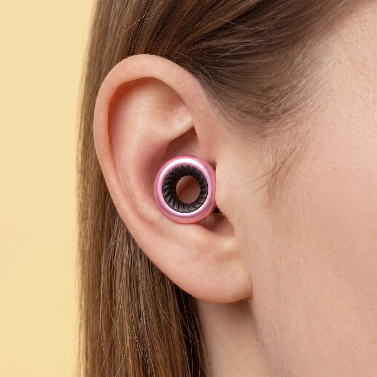 Ring Earplugs in Pink Black, worn in ear