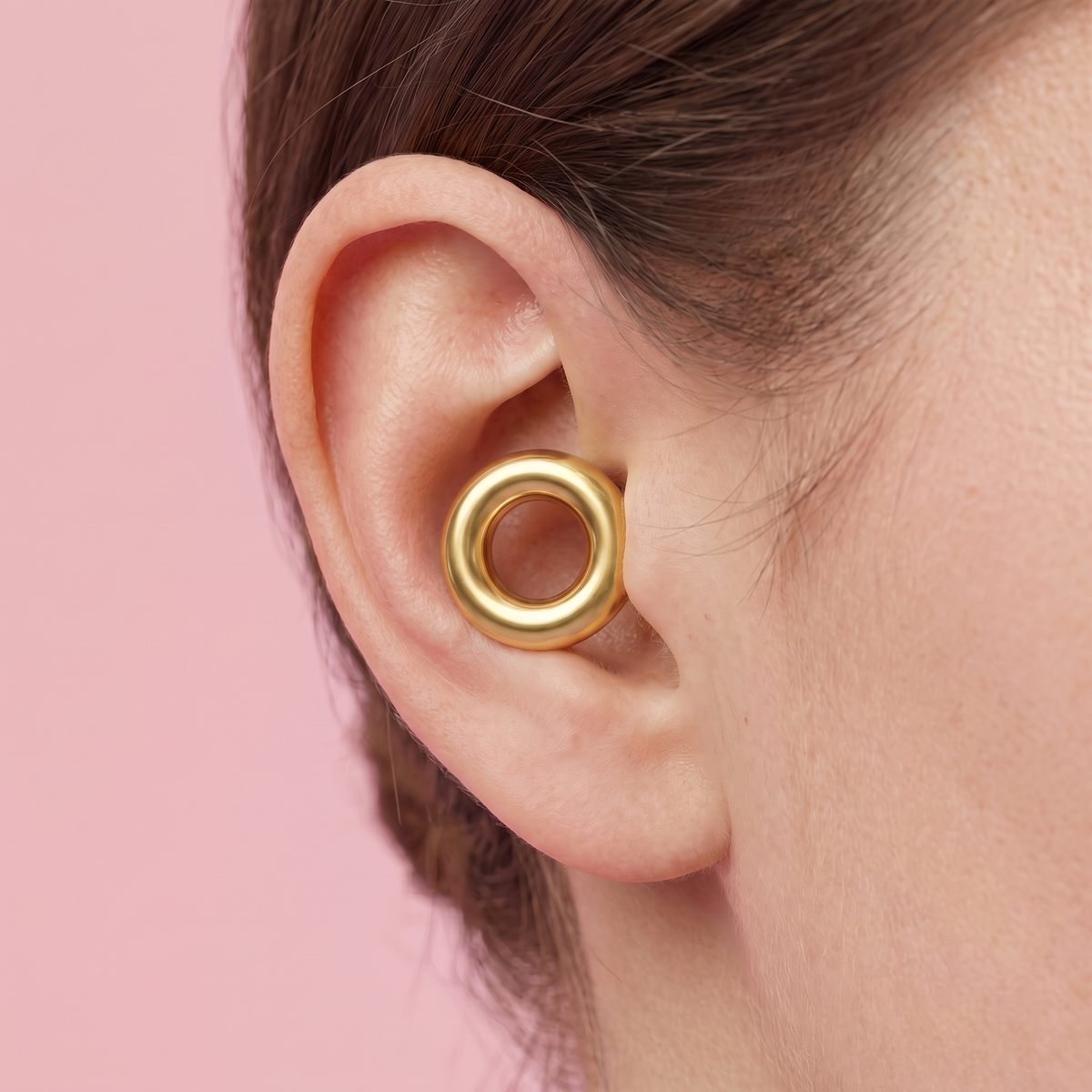 Metal Edition Earplugs in Gold, worn in ear