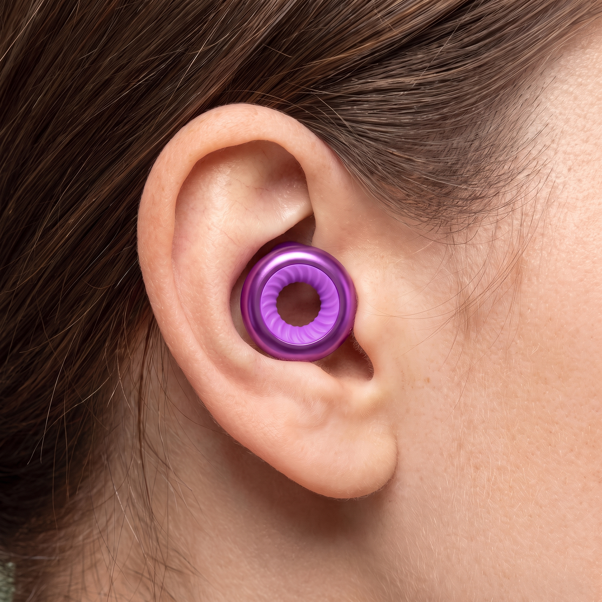 Ring Earplugs in Purple, worn in ear