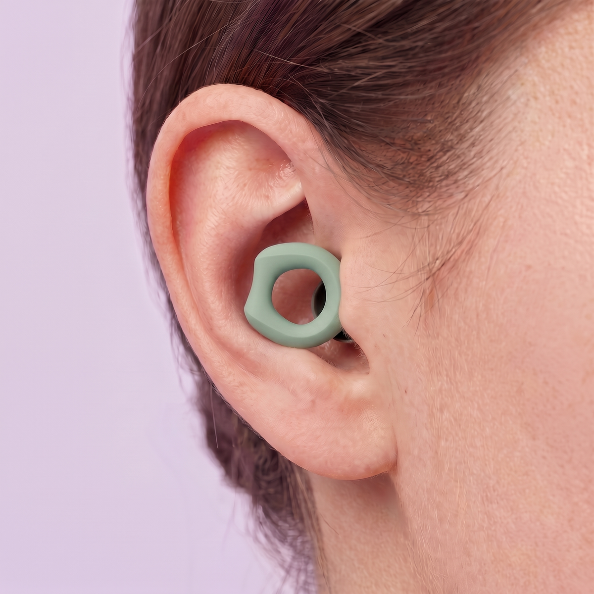 Silicone Earplugs in Green, worn in ear