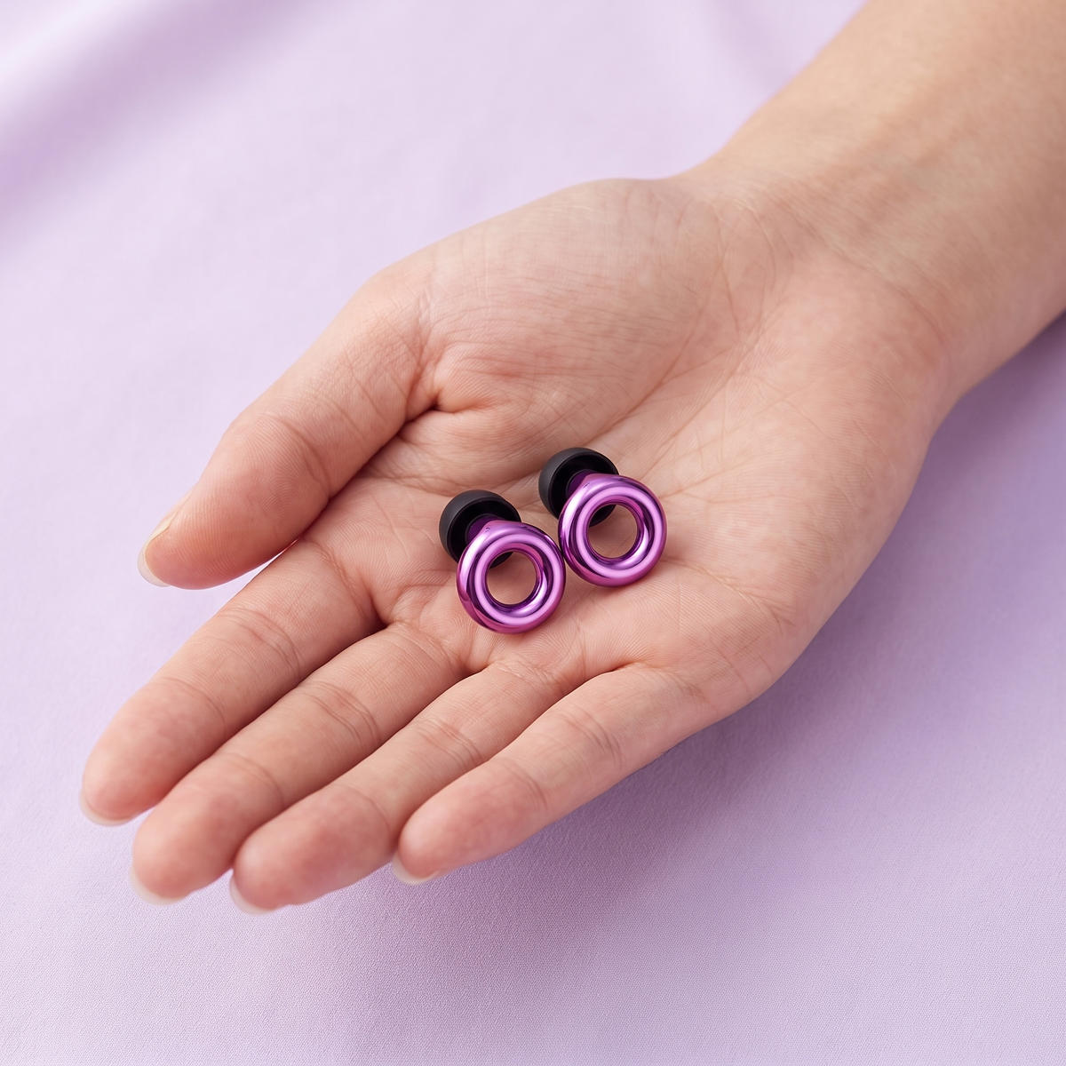Metal Edition Earplugs in Purple, in hand