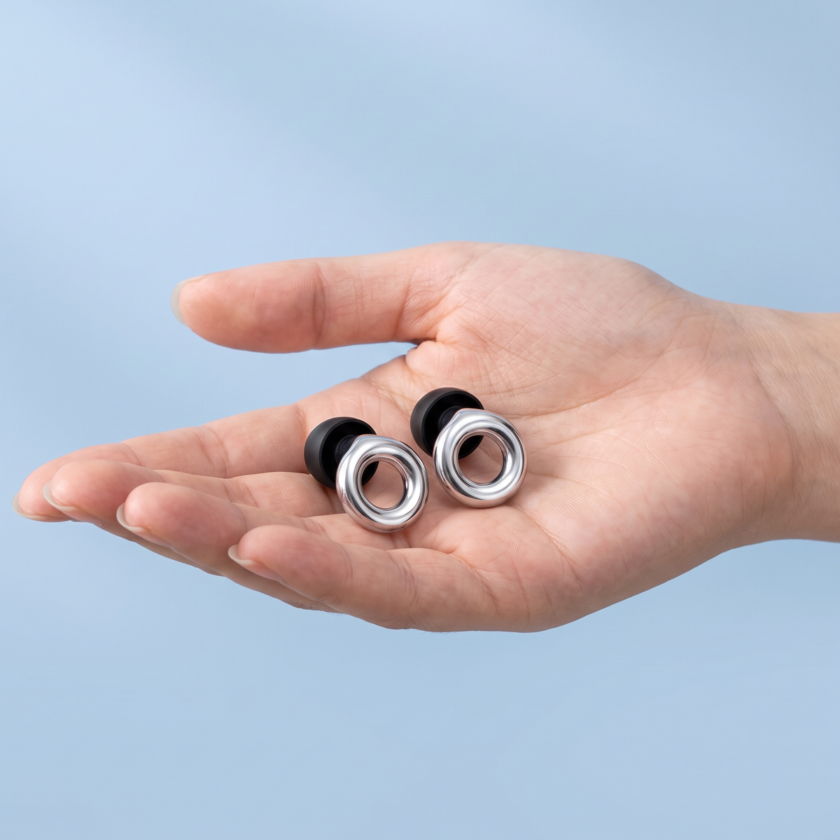Metal Edition Earplugs in Silver, in hand